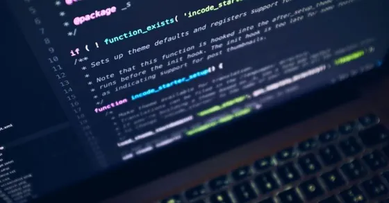 Close-up of programming code displayed on a laptop screen