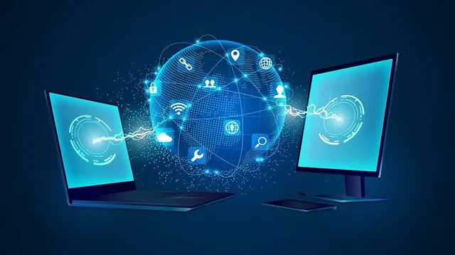 Illustration of a laptop and desktop monitor connected through a glowing network globe of icons